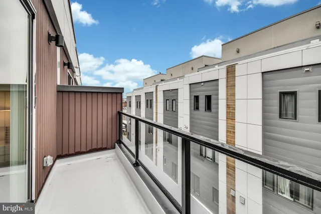 a view of balcony with furniture