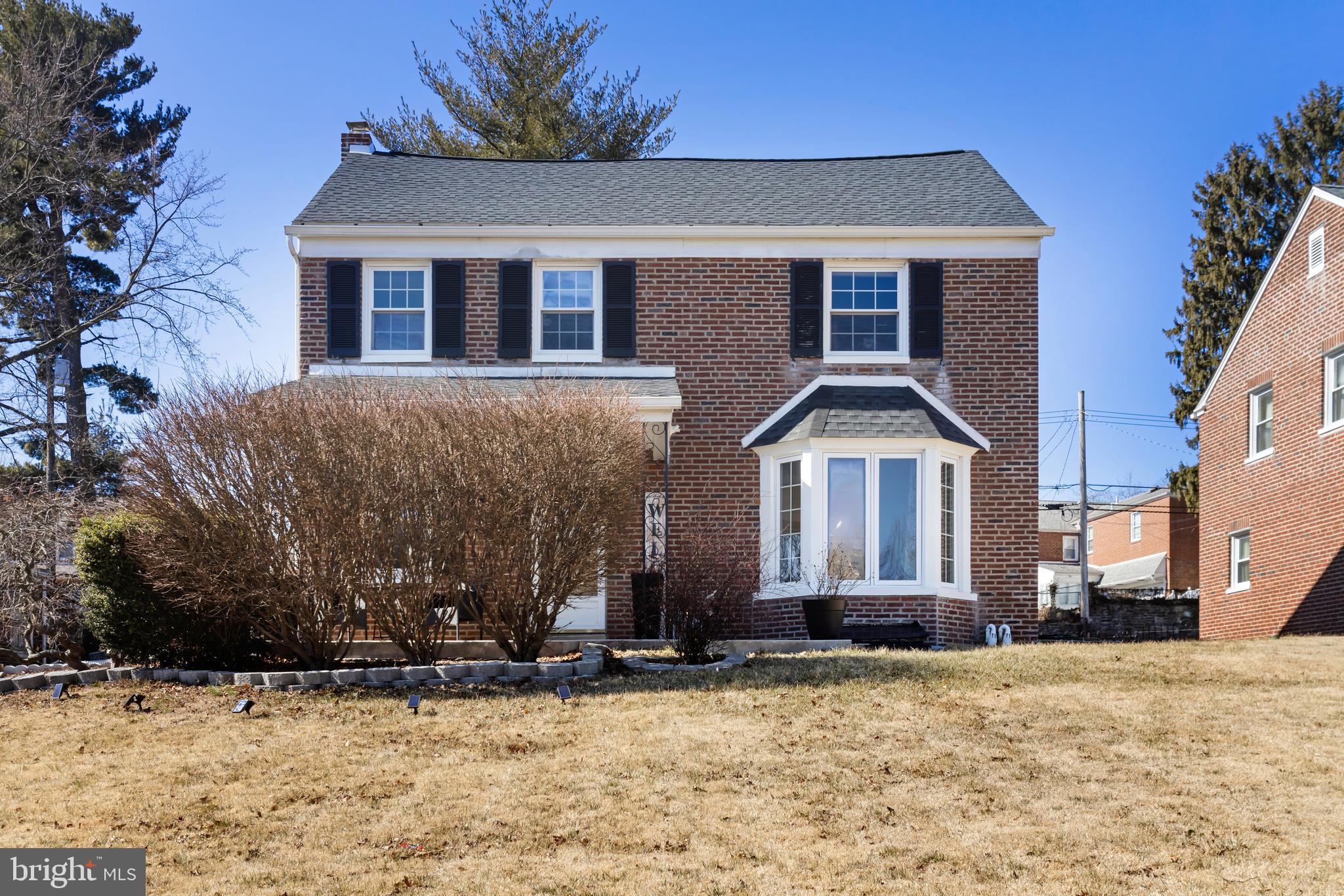 130 Johns Road Cheltenham, PA 19012 - Photo 3 of 50 a front view of a house with a yard covered with snow