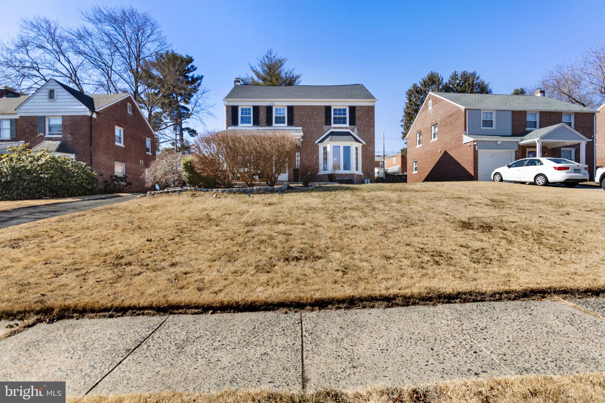 130 Johns Road Cheltenham, PA 19012 - Photo 6 of 50 a front view of a house with a yard