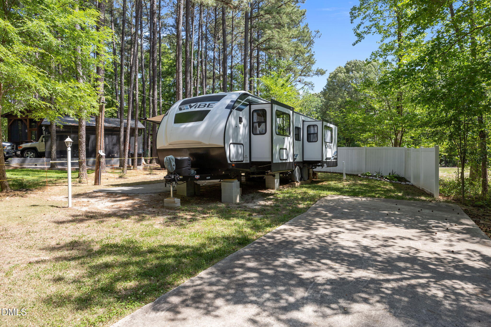 126 Kansas Drive Spring Hope, NC 27882 - Photo 2 of 31 a front view of a house with a yard table and chairs