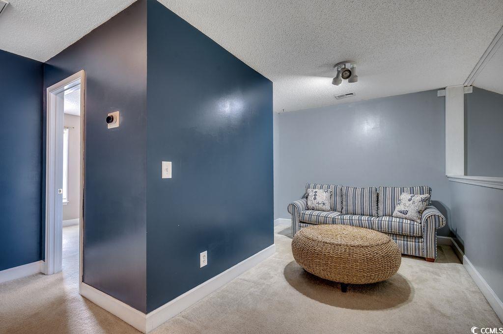 100 Culpepper Way, Unit 1002 Myrtle Beach, SC 29579 - Photo 19 of 39 Sitting room with carpet and a textured ceiling