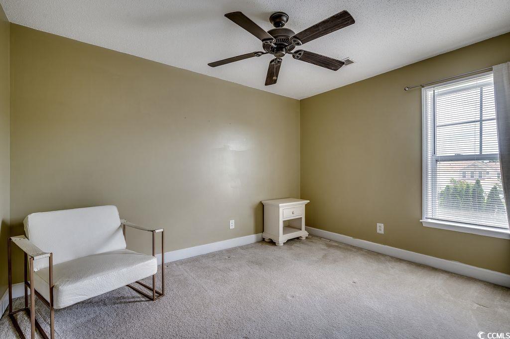100 Culpepper Way, Unit 1002 Myrtle Beach, SC 29579 - Photo 21 of 39 Unfurnished room featuring light carpet and a ceiling fan