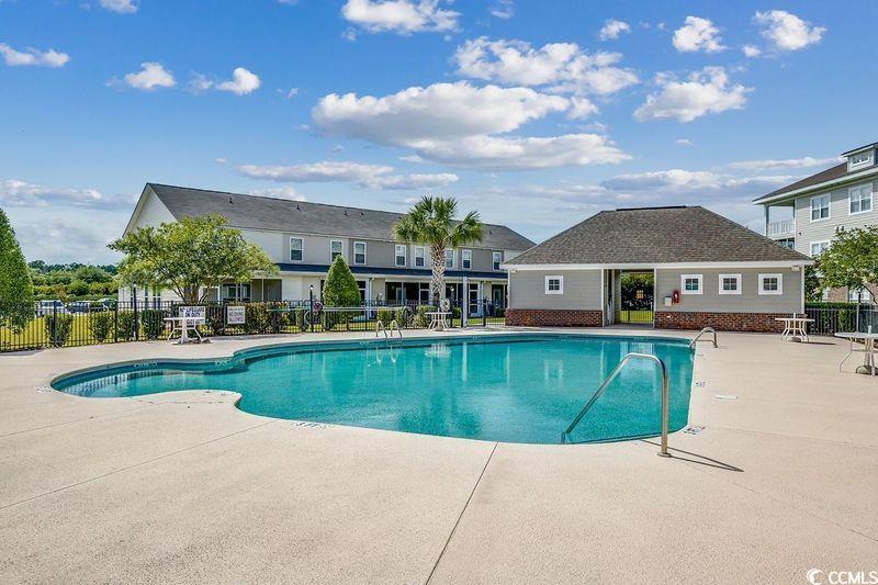 100 Culpepper Way, Unit 1002 Myrtle Beach, SC 29579 - Photo 27 of 39 Community pool with a patio
