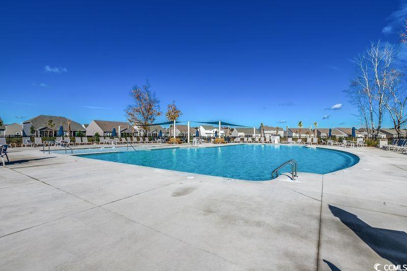 100 Culpepper Way, Unit 1002 Myrtle Beach, SC 29579 - Photo 29 of 39 Community pool featuring a patio and a residential view