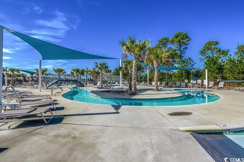 100 Culpepper Way, Unit 1002 Myrtle Beach, SC 29579 - Photo 31 of 39 Community pool with a patio area