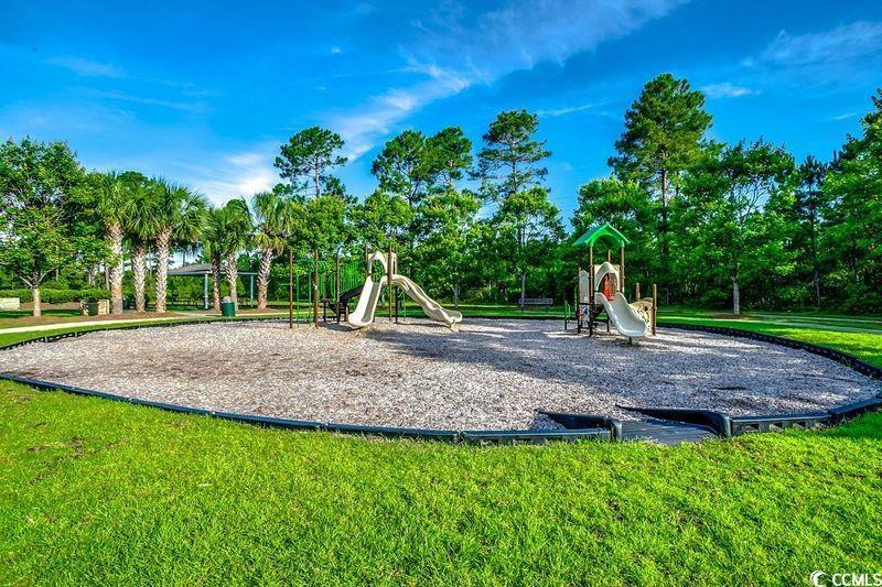 100 Culpepper Way, Unit 1002 Myrtle Beach, SC 29579 - Photo 35 of 39 Community play area featuring a lawn