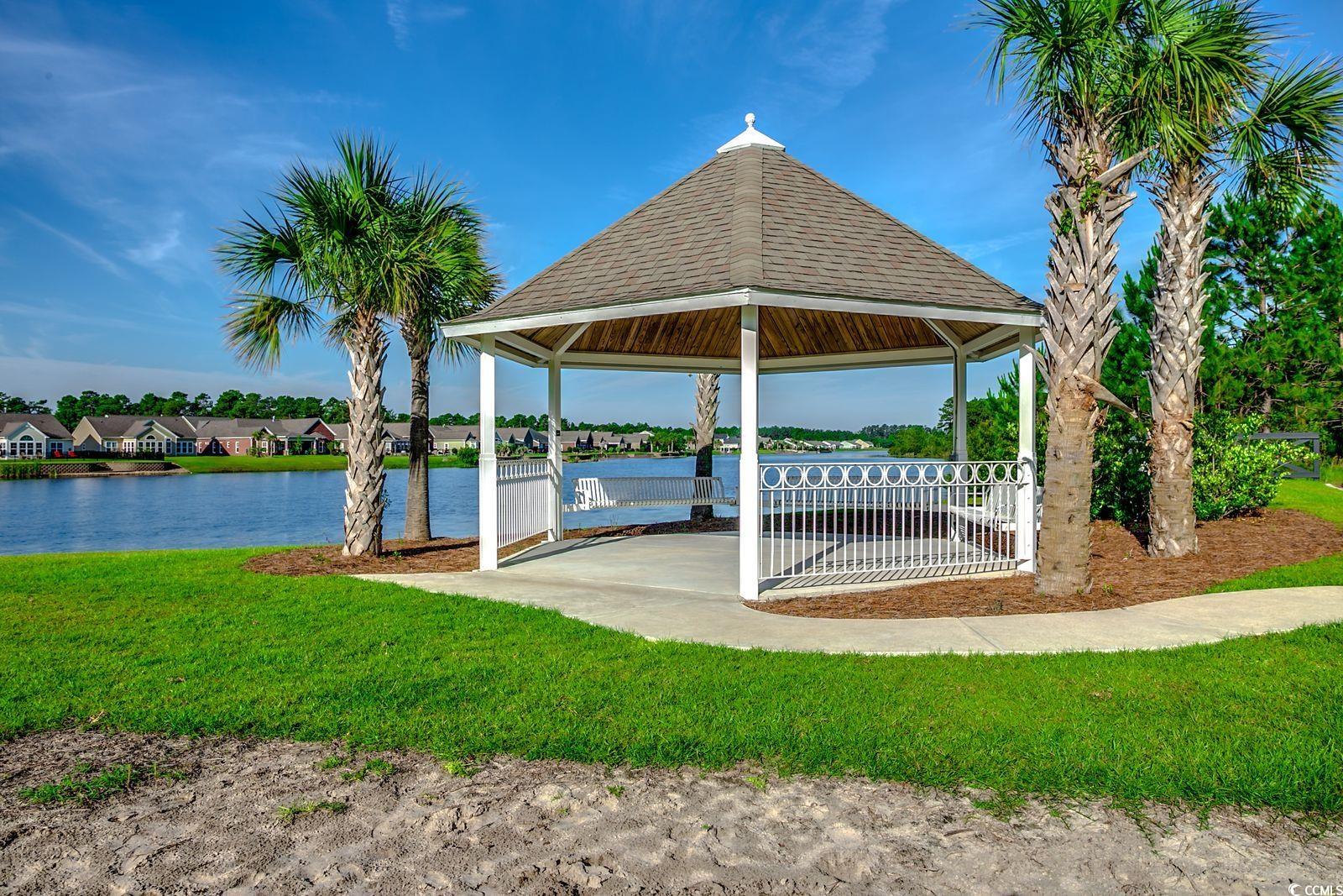 100 Culpepper Way, Unit 1002 Myrtle Beach, SC 29579 - Photo 38 of 39 Dock featuring a gazebo, a yard, and a water view
