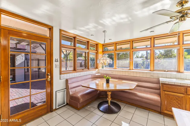 a large kitchen with stainless steel appliances kitchen island granite countertop a large counter top a stove a sink and a refrigerator