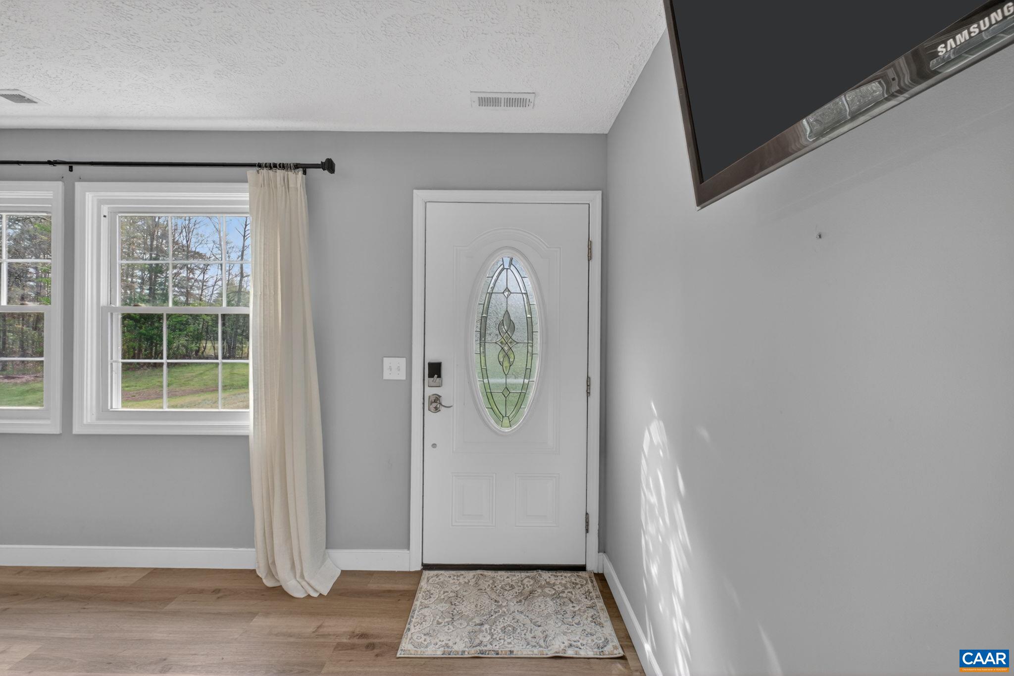 673 Cedar Lane Road Palmyra, VA 22963 - Photo 6 of 47 an entryway with a door and wooden floor