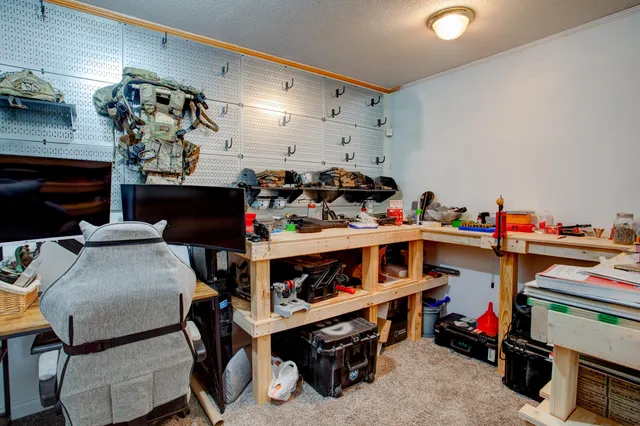 a view of a dining room with furniture and a kitchen