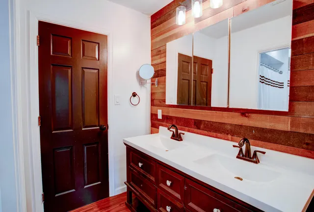a bathroom with a sink and a mirror