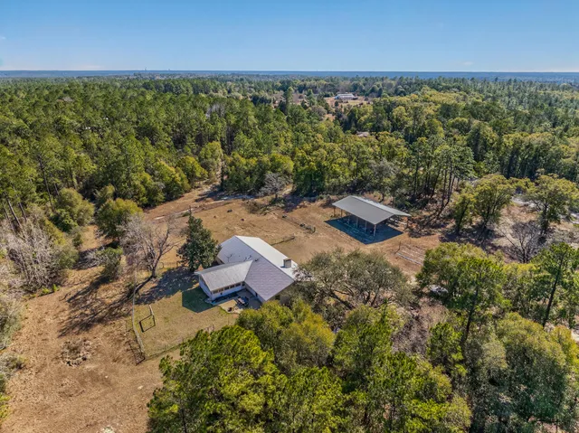 an aerial view of residential house with outdoor space