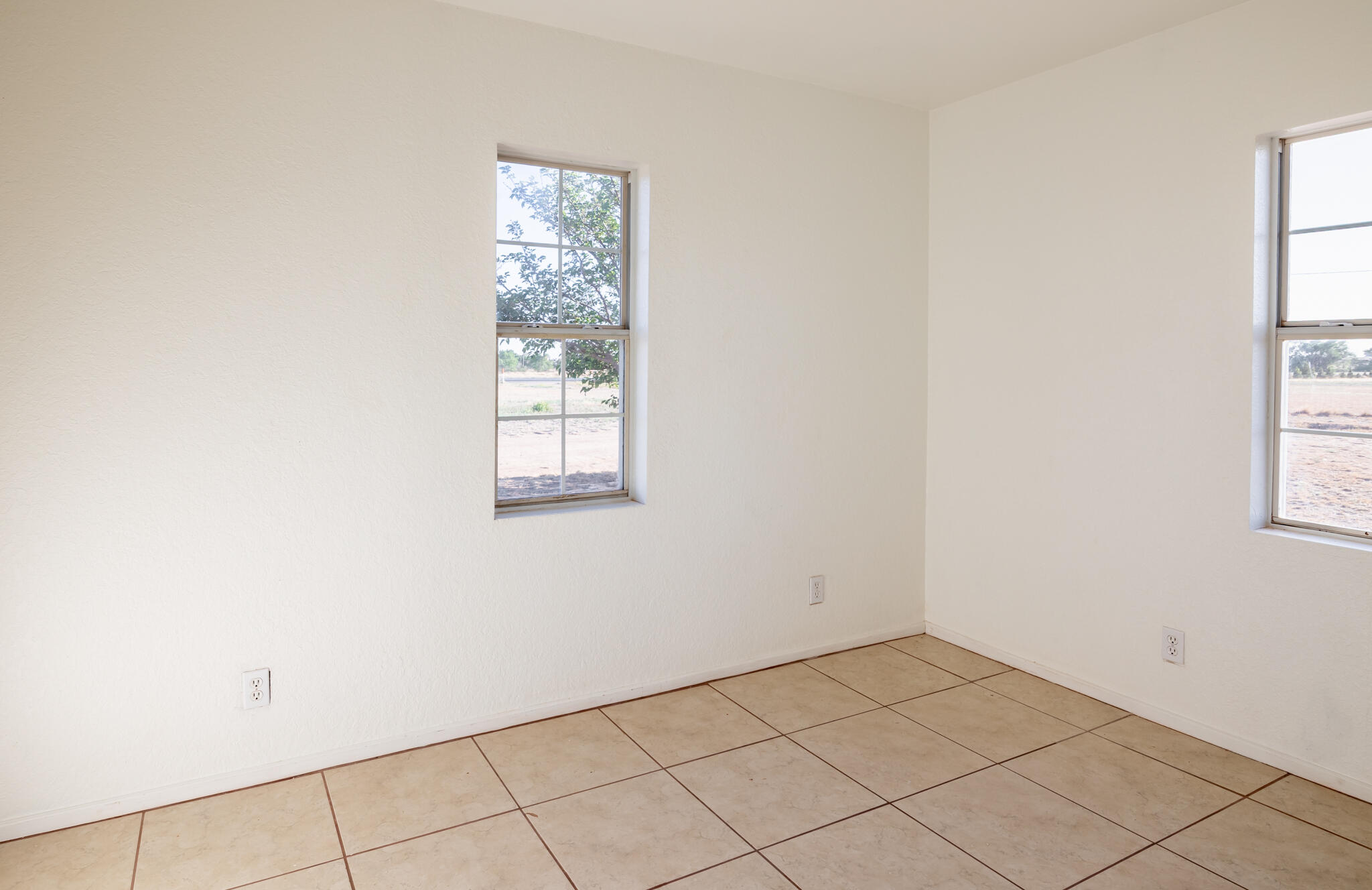 6917 Highway 114 Lubbock, TX 79407 - Photo 24 of 45 an empty room with windows