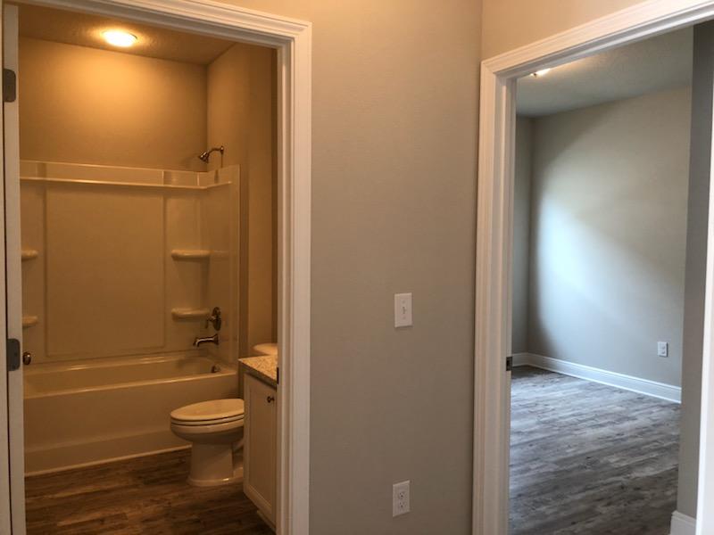155 Stonegate Circle, Unit 69 Santa Rosa Beach, FL 32459 - Photo 15 of 31 a bathroom with a granite countertop toilet a sink and shower