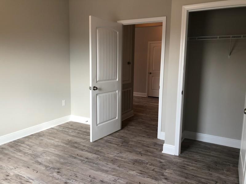 155 Stonegate Circle, Unit 69 Santa Rosa Beach, FL 32459 - Photo 16 of 31 an empty room with wooden floor and closet