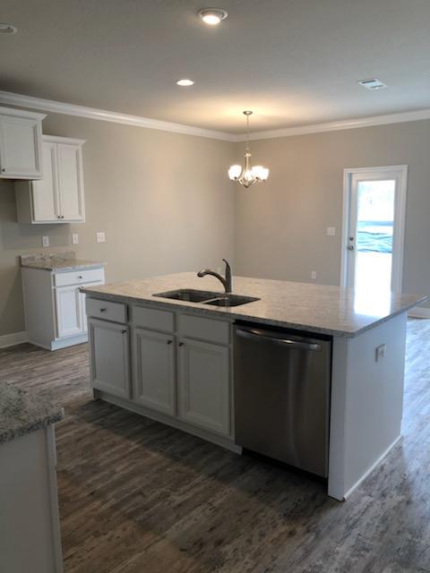 155 Stonegate Circle, Unit 69 Santa Rosa Beach, FL 32459 - Photo 18 of 31 a kitchen with a sink and cabinets