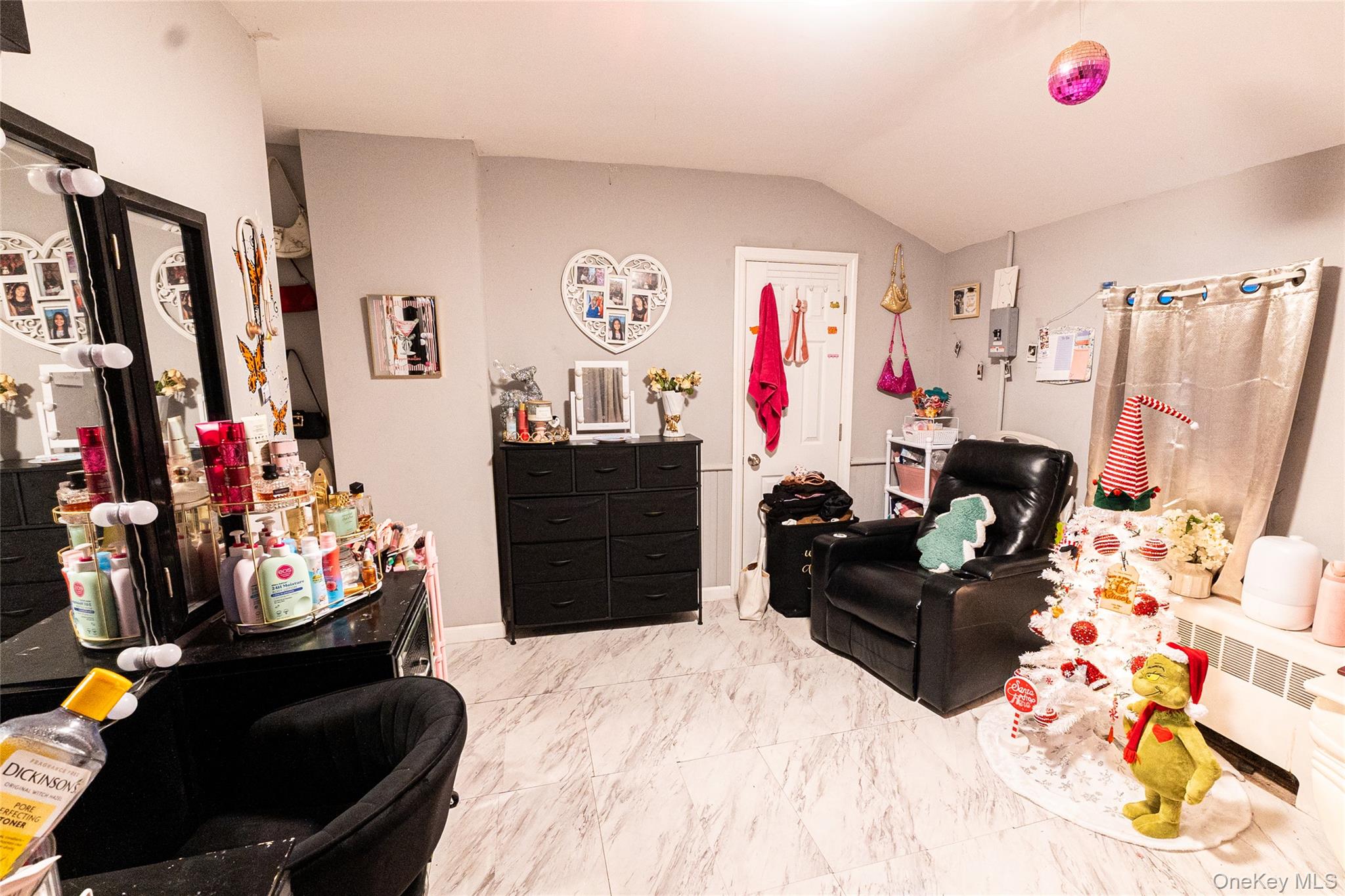 163 Orchard Road East Patchogue, NY 11772 - Photo 12 of 26 Living room with lofted ceiling and light marble finish flooring