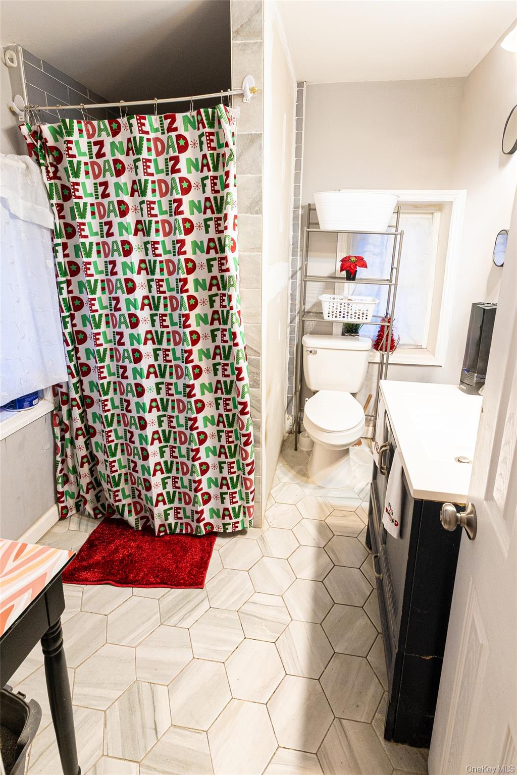 163 Orchard Road East Patchogue, NY 11772 - Photo 14 of 26 Bathroom featuring vanity, a shower with shower curtain, and light tile patterned floors
