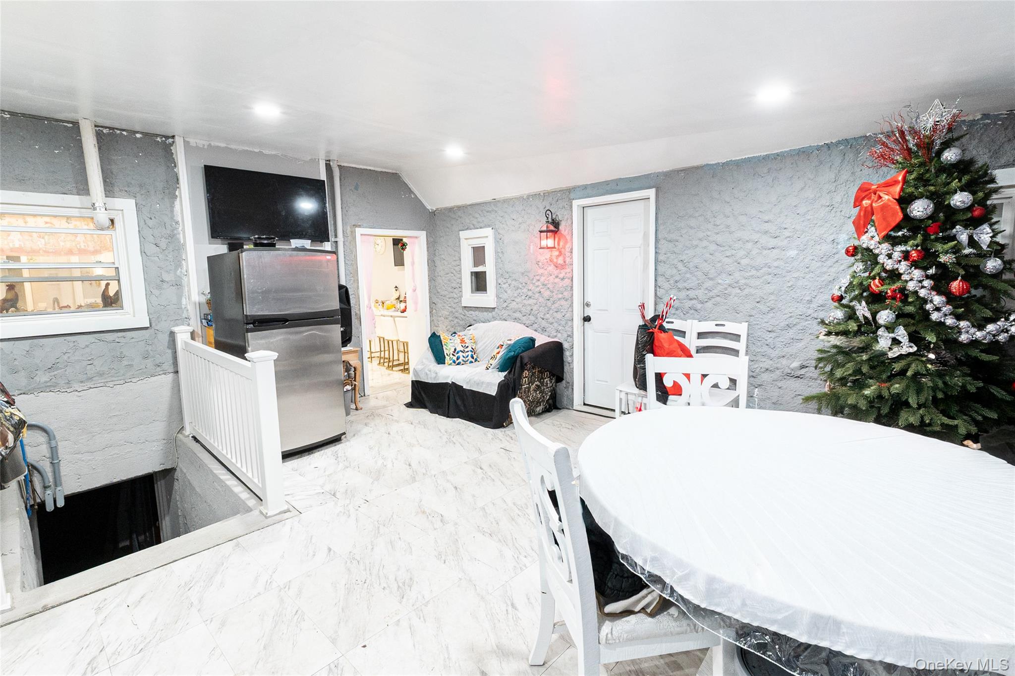 163 Orchard Road East Patchogue, NY 11772 - Photo 8 of 26 Dining area featuring recessed lighting and light marble finish floors