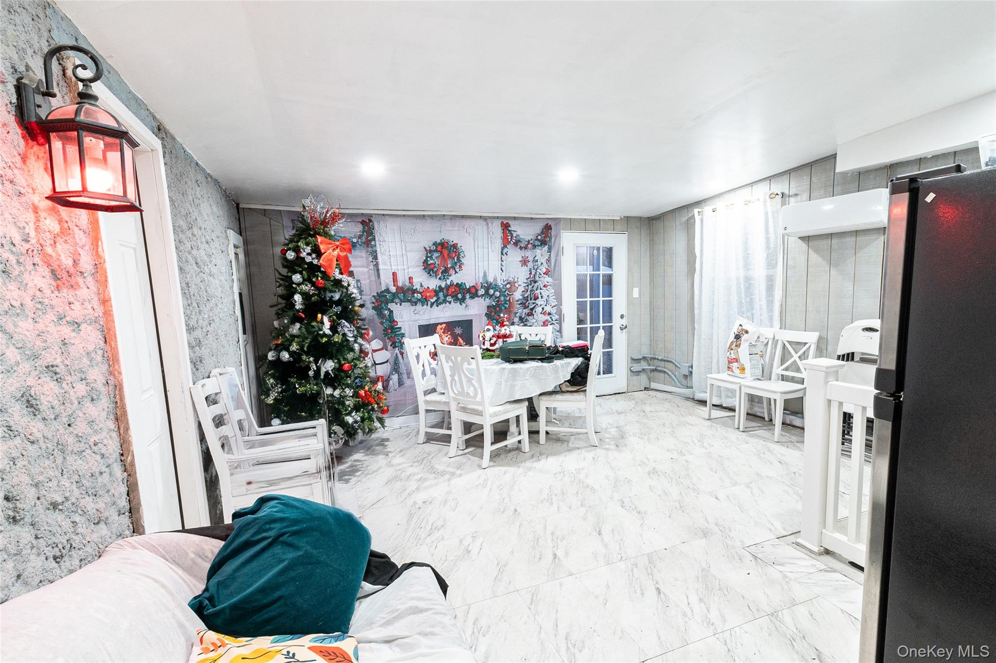163 Orchard Road East Patchogue, NY 11772 - Photo 9 of 26 Dining room featuring marble finish flooring and wallpapered walls