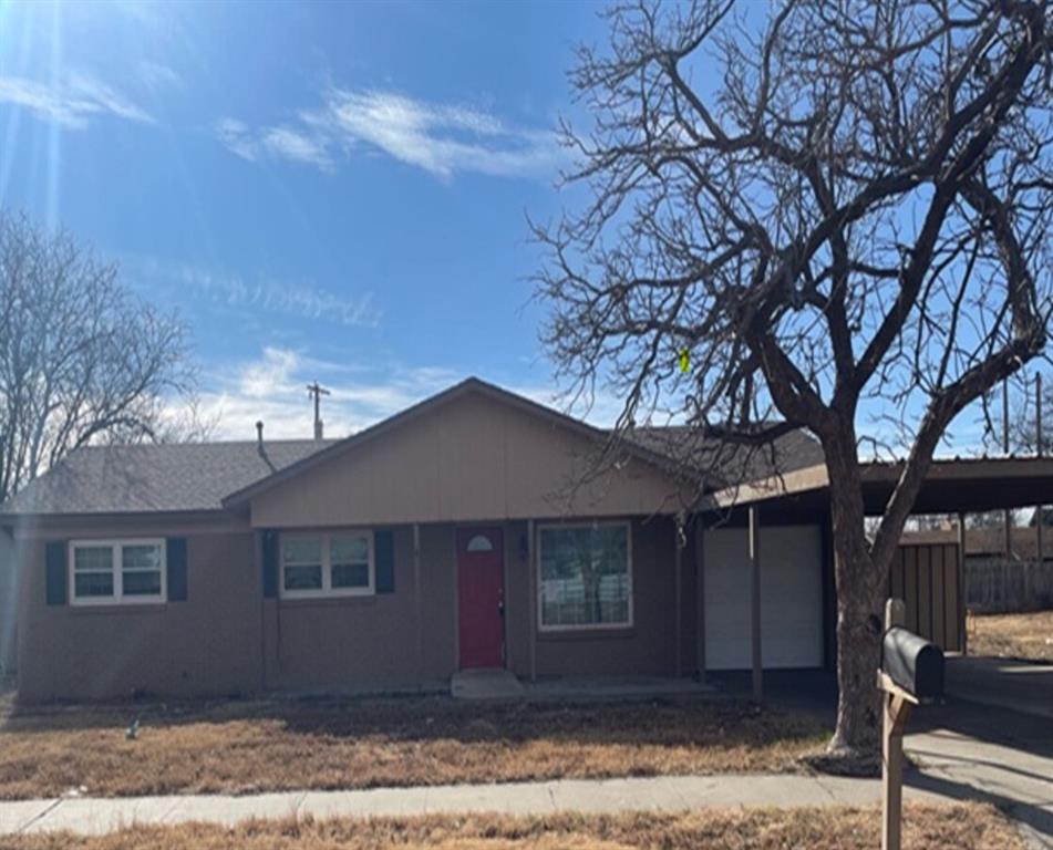 809 West 27th Street Plainview, TX 79072 - Photo 1 of 1 a front view of a house with yard and tree
