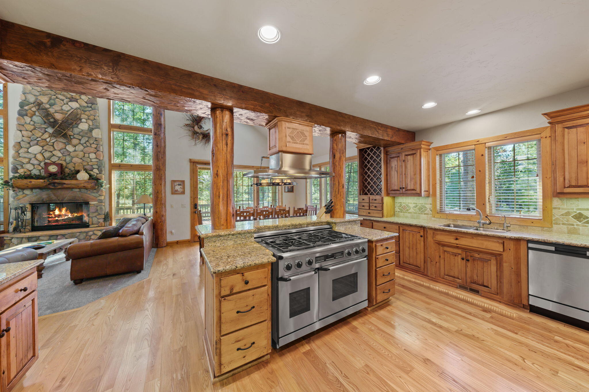 58026 Kinglet Road Sunriver, OR 97707 - Photo 14 of 39 a kitchen with stainless steel appliances granite countertop a stove and a sink