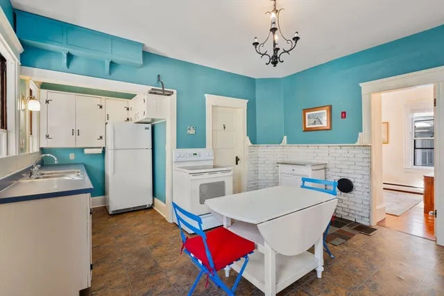 a living room with furniture a table and chairs