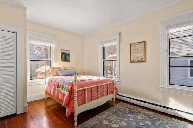 a bedroom with a bed and window