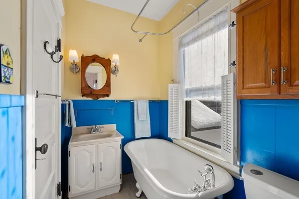 a bathroom with a toilet a sink and a shower