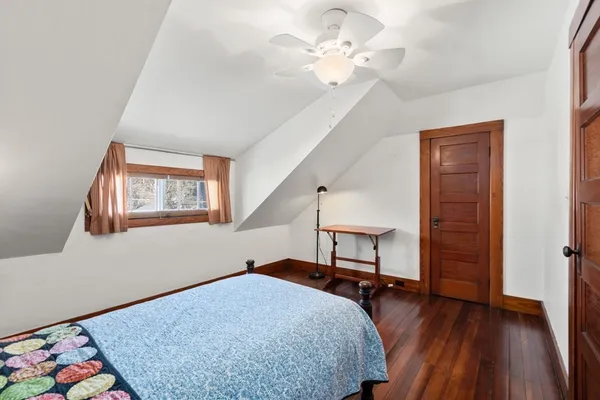 a bedroom with furniture and a window