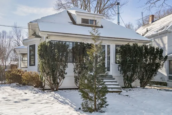 a view of a house with a tree
