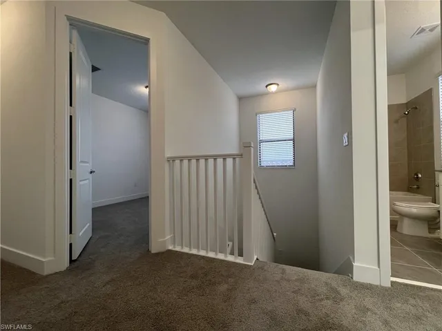 a view of a hallway with closet area