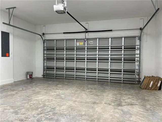 a view of an empty room with a staircase