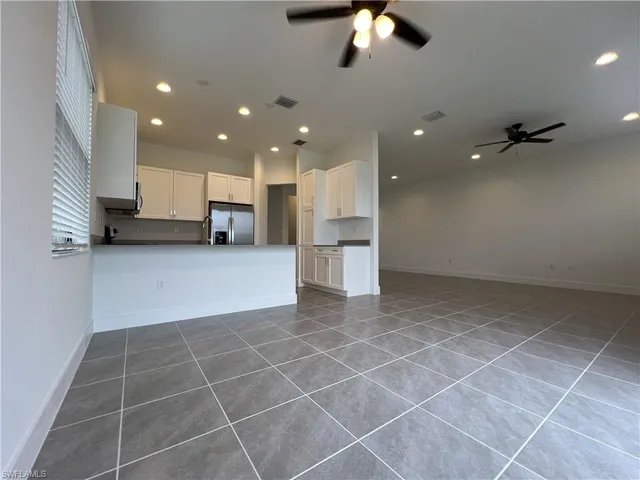 a view of a kitchen with furniture and a chandelier