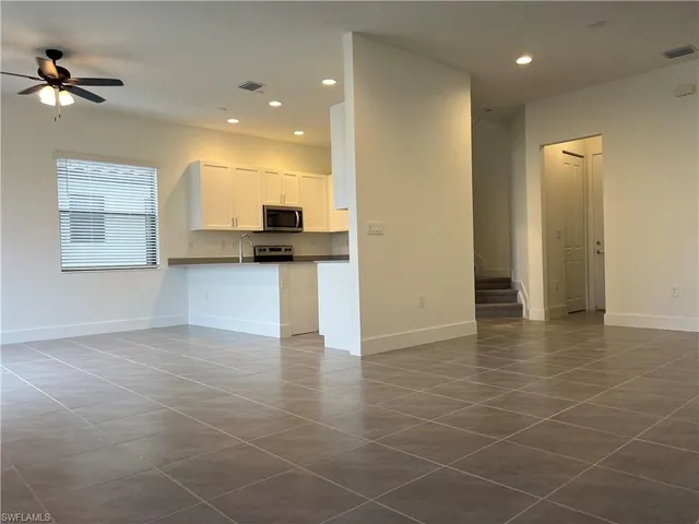 a view of a kitchen with a sink cabinets and a window