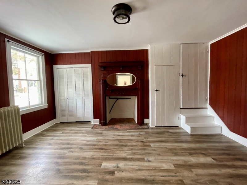 632 3rd Street Belvidere, NJ 07823 - Photo 6 of 11 a view of an empty room with wooden floor and a window