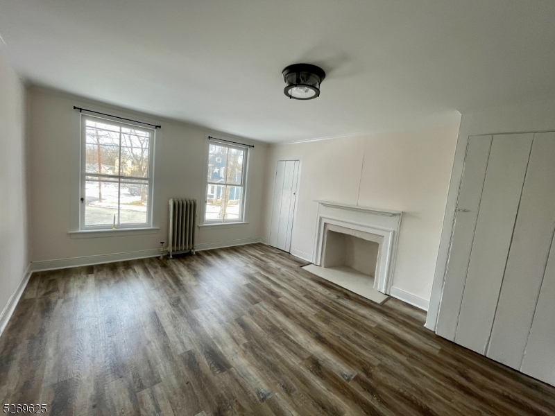 632 3rd Street Belvidere, NJ 07823 - Photo 9 of 11 an empty room with windows and fireplace