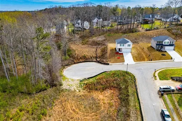 a view of a swimming pool with a yard
