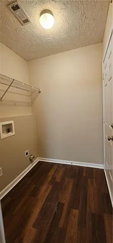 an empty room with wooden floor