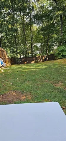 a view of a lake with a yard