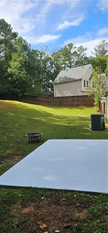 a view of a yard with an outdoor space