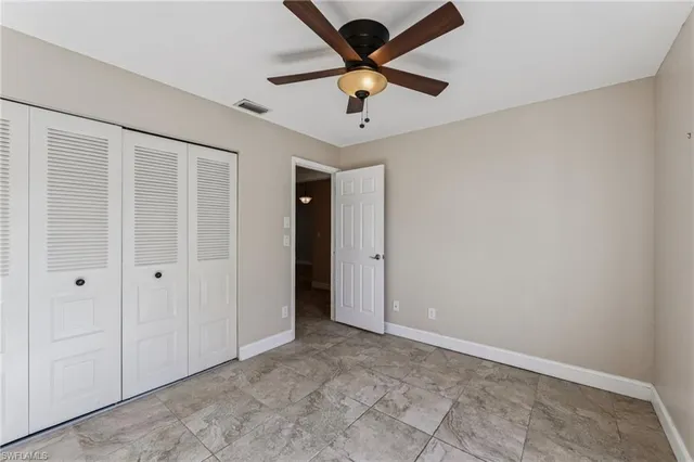 a bathroom with a toilet a sink a mirror a bathtub and shower