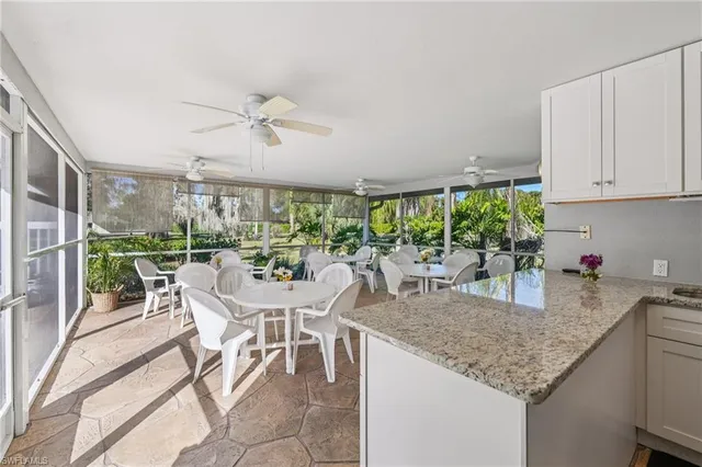 a very nice looking dining room with furniture window and outside view
