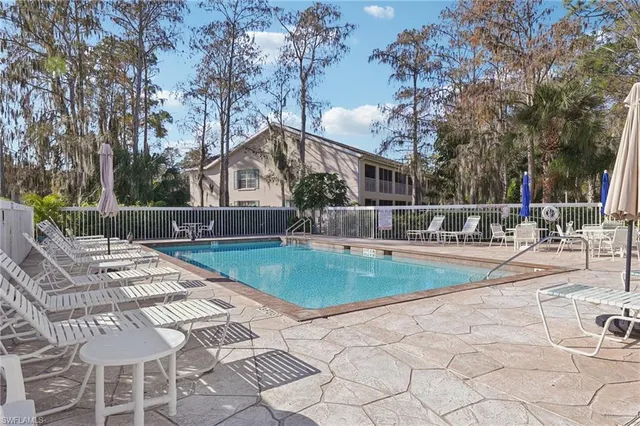 a view of swimming pool with seating space