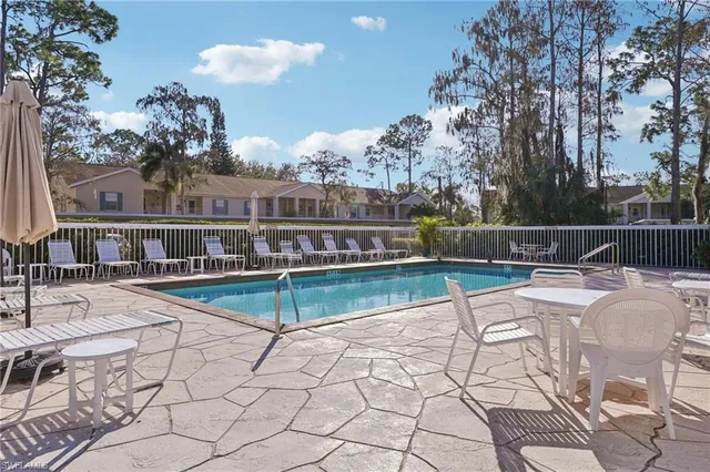 a view of a swimming pool with a patio