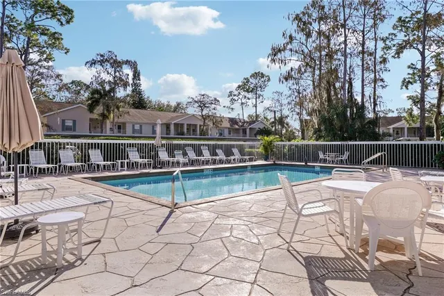 a house view with a seating space and a garden