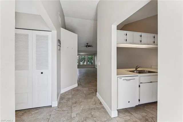 a view of a kitchen from the hallway