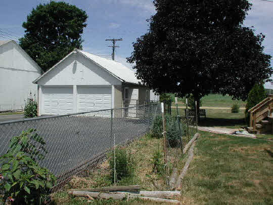 102 Washington Ridott, IL 61067 - Photo 6 of 6 a front view of a house with garden