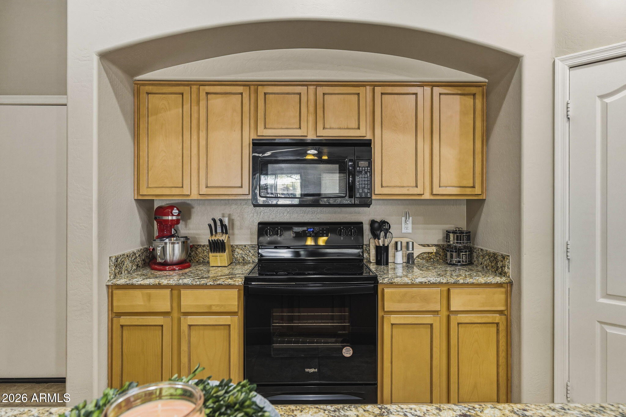 11 West Cooper Canyon Road San Tan Valley, AZ 85143 - Photo 10 of 31 a kitchen with stainless steel appliances granite countertop a stove a sink and a microwave