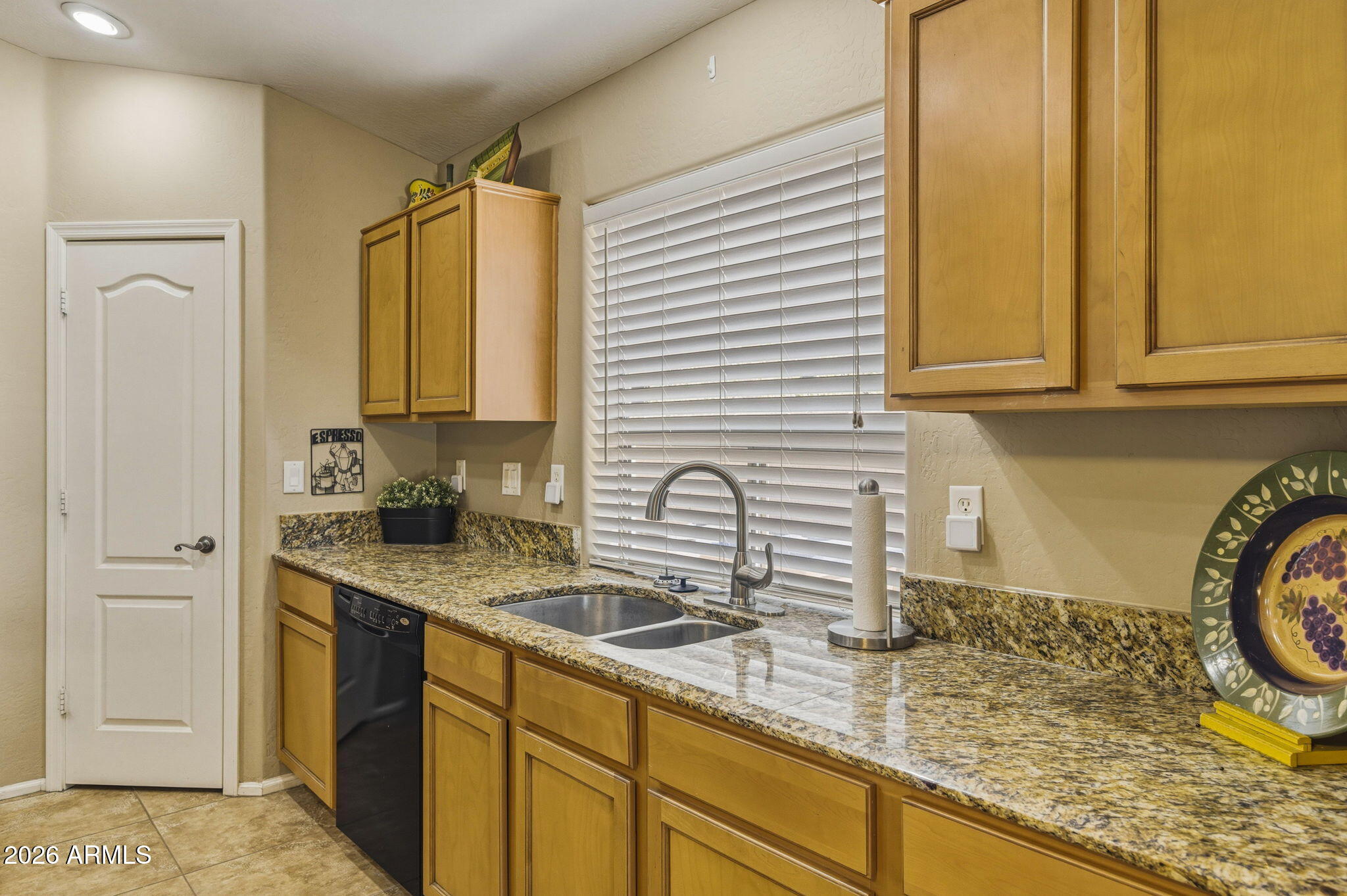 11 West Cooper Canyon Road San Tan Valley, AZ 85143 - Photo 11 of 31 a kitchen with sink a window and cabinets